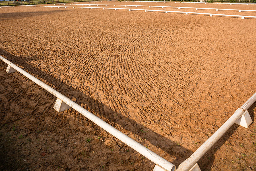 Why You Should Invest in a Sand Groomer | Performance Footing